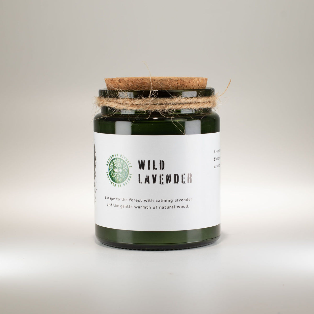 Wild Lavender Woodwick Candle in a green glass jar